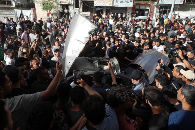 Palestinians Gather at Site of Israeli Strike in Gaza City others. May 20, 2026: Palestinians Gather at Site of Israeli Strike in Gaza City Palestinians gather at the site of an Israeli airstrike that targeted a vehicle on al-Shuhada Street in Gaza City, on May 19, 2026. According to local sources, the strike killed one person and wounded several others. Copyright: xx