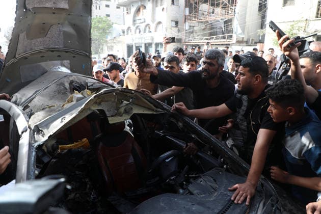 Palestinians Gather at Site of Israeli Strike in Gaza City others. May 20, 2026: Palestinians Gather at Site of Israeli Strike in Gaza City Palestinians gather at the site of an Israeli airstrike that targeted a vehicle on al-Shuhada Street in Gaza City, on May 19, 2026. According to local sources, the strike killed one person and wounded several others. Copyright: xx