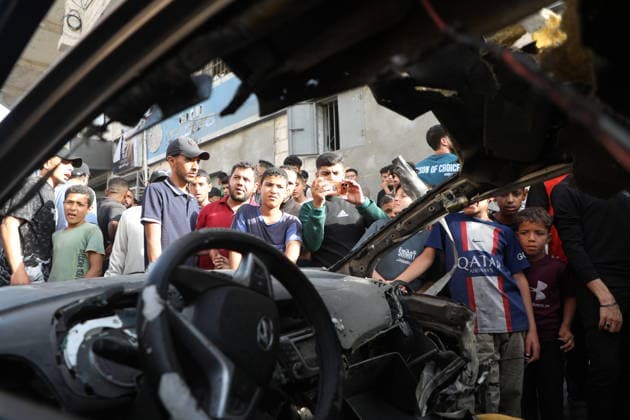 Palestinians Gather at Site of Israeli Strike in Gaza City others. May 20, 2026: Palestinians Gather at Site of Israeli Strike in Gaza City Palestinians gather at the site of an Israeli airstrike that targeted a vehicle on al-Shuhada Street in Gaza City, on May 19, 2026. According to local sources, the strike killed one person and wounded several others. Copyright: xx