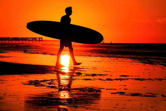 May 20, 2026, Isle Of Palms, Sc, United States: A surfer silhouetted by the sunrise carries his board out into deeper water on Front Beach, May 20, 2026 in Isle of Palms, South Carolina. Isle Of Palms United States - ZUMAe02_ 20260520_zaf_e02_001 Copyright: xRichardxEllisx