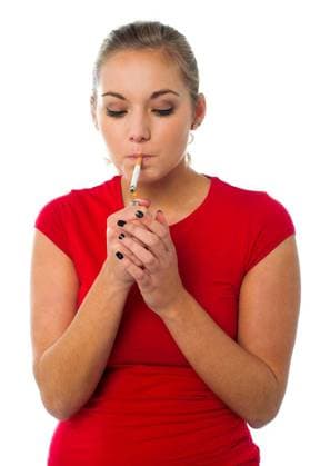 Beautiful woman smoking a cigarette model released Symbolfoto Copyright: xstockyimagesx Panthermedia70684412.jpg