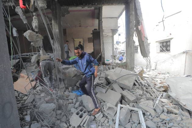Palestinians Inspect Destroyed Homes After Israeli Strike in al-Maghazi Palestinians inspect their destroyed homes following an overnight Israeli airstrike in al-Maghazi refugee camp in the central Gaza Strip, on May 21, 2026. Israeli warplanes carried out a strike overnight targeting a house belonging to the Abu Ismail family after residents were warned to evacuate the building. Photo by Hassan al-Jedi apaimages Nusairat Gaza Strip Palestinian Territory 210526_Maghazi_HJ_00(15).jpeg Copyright: xapaimagesxHassanxal-Jedixx xapaimagesx
