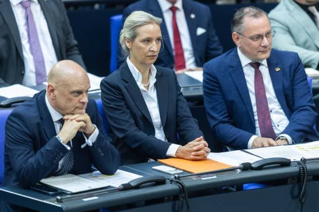 80 Session of the German Bundestag on 21 05 2026 in the plenary chamber of the Reichstag building in Berlin Enrico Komning Parliamentary Secretary Parliamentary Group Alternative for Germany AfD , left Alice Weidel Parliamentary Group Leader Alternative for Germany AfD , center Tino Chrupalla Parliamentary Group Leader Alternative for Germany AfD , right xJRx