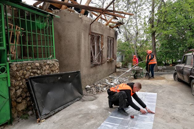 RECORD DATE NOT STATED Russian Drone Attack on Odesa Leaves People Injured Municipal workers deal with the aftermath of a Russian drone attack in Odesa, Ukraine, on May 18, 2026. As a result of a massive overnight attack by Russian strike drones, several residential buildings in the Prymorskyi and Kyivskyi districts sustained significant damage. Roofs of three-storey buildings were destroyed, while a one-storey house was ruined in another area. Buildings of a city lyceum and a kindergarten were also damaged. Two people, an 11-year-old boy and a 59-year-old man, were injured Photo by Nina Liashonok Ukrinform ABACAPRESS.COM Odesa Ukraine  Copyright: xLyashonokxNina Ukrinform ABACAx