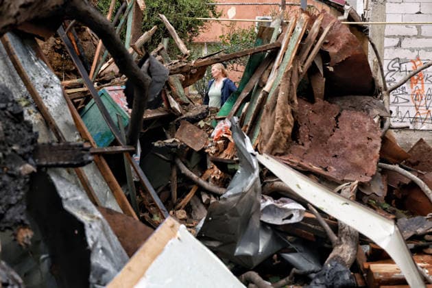 RECORD DATE NOT STATED Russian Drone Attack on Odesa Leaves People Injured A woman stands near a private residential house destroyed as a result of a Russian drone attack in Odesa, Ukraine, on May 20, 2026. During the night of May 20, the city came under a massive attack by Russian strike drones. The attack caused destruction of residential buildings, fires at commercial facilities, and damage to critical infrastructure. One civilian was injured Photo by Nina Liashonok Ukrinform ABACAPRESS.COM Odesa Ukraine  Copyright: xLyashonokxNina Ukrinform ABACAx