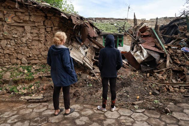 RECORD DATE NOT STATED Russian Drone Attack on Odesa Leaves People Injured People inspect a private residential house destroyed as a result of a Russian drone attack in Odesa, Ukraine, on May 20, 2026. During the night of May 20, the city came under a massive attack by Russian strike drones. The attack caused destruction of residential buildings, fires at commercial facilities, and damage to critical infrastructure. One civilian was injured Photo by Nina Liashonok Ukrinform ABACAPRESS.COM Odesa Ukraine  Copyright: xLyashonokxNina Ukrinform ABACAx