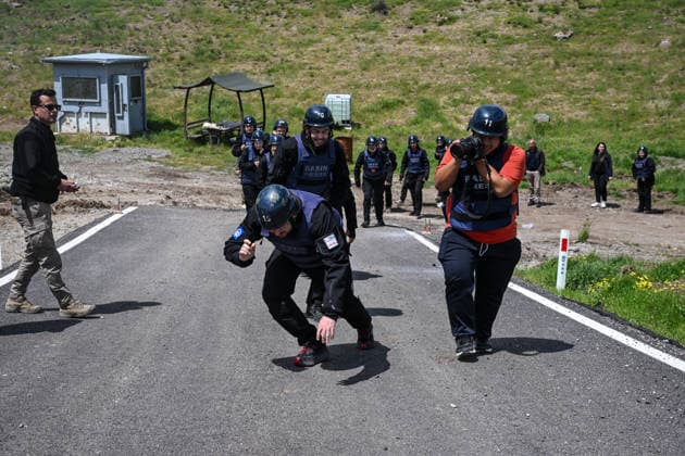 Anadolu s 29th War Journalism Program held in Ankara ANKARA, TURKIYE - MAY 21: Journalists take part in the 29th Term War Journalism Certificate Program at a specialized tactical training facility in Ankara, Turkiye on May 21, 2026. Jointly organized by Anadolu Agency (AA), the Police Academy, and the Turkish Cooperation and Coordination Agency (TIKA), the rigorous international training program equips reporters with essential survival skills for operating safely in hostile war zones and high-risk conflict theaters. Trainees receive theoretical and practical training on explosives , mines and booby traps , and dangerous areas from bomb disposal experts at the Criminal Department on the 11th day of the 29th Term War Journalism Certifi  Copyright: x2026xAnadoluxAbdullahxGuclux