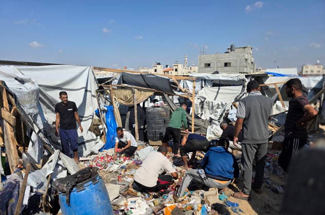 Palestinian Rescue Teams Inspect Site of Israeli Strike in Khan Younis Palestinian paramedics, civil defense crews and residents inspect the site of an Israeli airstrike that targeted a tent sheltering displaced people in the Mawasi area of Khan Younis in the southern Gaza Strip, on May 21, 2026. According to local sources, the strike wounded several displaced Palestinians, sparked a fire in the targeted tent and caused extensive damage to nearby tents. Photo by Tariq Mohammad APA Images Khan Yunis Gaza Strip Palestinian Territory 210526_Khan_Yunis_TM_02(12) Copyright: xapaimagesxTariqxMohammad xapaimagesx