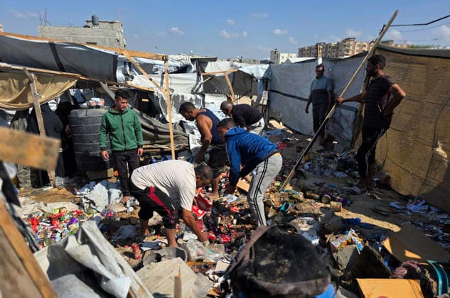 Palestinian Rescue Teams Inspect Site of Israeli Strike in Khan Younis Palestinian paramedics, civil defense crews and residents inspect the site of an Israeli airstrike that targeted a tent sheltering displaced people in the Mawasi area of Khan Younis in the southern Gaza Strip, on May 21, 2026. According to local sources, the strike wounded several displaced Palestinians, sparked a fire in the targeted tent and caused extensive damage to nearby tents. Photo by Tariq Mohammad APA Images Khan Yunis Gaza Strip Palestinian Territory 210526_Khan_Yunis_TM_02(15) Copyright: xapaimagesxTariqxMohammad xapaimagesx