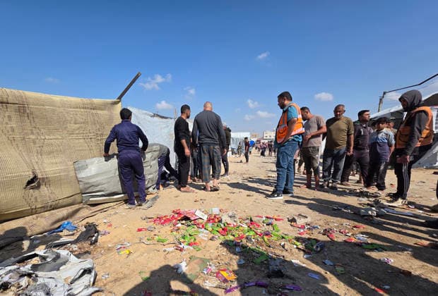 Palestinian Rescue Teams Inspect Site of Israeli Strike in Khan Younis Palestinian paramedics, civil defense crews and residents inspect the site of an Israeli airstrike that targeted a tent sheltering displaced people in the Mawasi area of Khan Younis in the southern Gaza Strip, on May 21, 2026. According to local sources, the strike wounded several displaced Palestinians, sparked a fire in the targeted tent and caused extensive damage to nearby tents. Photo by Tariq Mohammad APA Images Khan Yunis Gaza Strip Palestinian Territory 210526_Khan_Yunis_TM_02(6) Copyright: xapaimagesxTariqxMohammad xapaimagesx