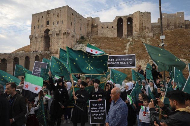 Syrian Circassians commemorate to mark the 162nd anniversary of their exile in Aleppo ALEPPO, SYRIA - MAY 21: Circassians gather to commemorate the 162nd anniversary of the 1864 Circassian Exile, holding memorial events and honoring those who lost their lives during the deportation, on May 21, 2026, in Aleppo, Syria. Participants held a moment of silence in front of the Aleppo Citadel, wearing black T-shirts and traditional Circassian clothing while carrying Circassian and Syrian flags. Kasim Yusuf Anadolu Aleppo Syria. Editorial use only. Please get in touch for any other usage.  Copyright: x2026xAnadoluxKasimxYusufx