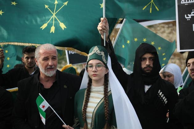 Syrian Circassians commemorate to mark the 162nd anniversary of their exile in Aleppo ALEPPO, SYRIA - MAY 21: Circassians gather to commemorate the 162nd anniversary of the 1864 Circassian Exile, holding memorial events and honoring those who lost their lives during the deportation, on May 21, 2026, in Aleppo, Syria. Participants held a moment of silence in front of the Aleppo Citadel, wearing black T-shirts and traditional Circassian clothing while carrying Circassian and Syrian flags. Kasim Yusuf Anadolu Aleppo Syria. Editorial use only. Please get in touch for any other usage.  Copyright: x2026xAnadoluxKasimxYusufx