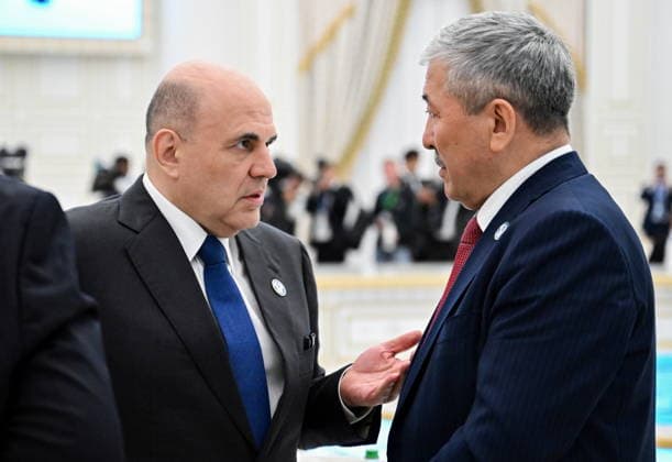 TURKMENISTAN, ASHGABAT - MAY 22, 2026: Mikhail Mishustin (L), Prime Minister of Russia, and Adylbek Kasymaliev, Chairman of the Cabinet of Ministers Head of the Presidential Administration of Kyrgyzstan, chat during an expanded meeting of the CIS (Commonwealth of Independent States) Council of the Heads of Government at the Garagum Hotel and Business Centre Ashgabat Turkmenistan  - ZUMAt113 20260522_zaa_t113_216 Copyright: xAlexanderxMiridonovx