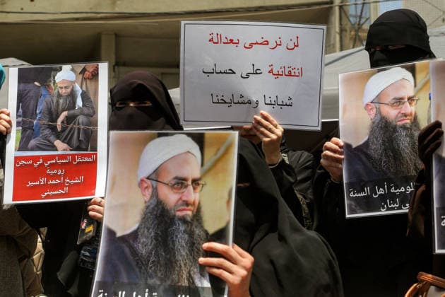 May 22, 2026, Beirut, Beirut, Lebanon: Fully veiled Sunni Muslim women display pictures of Salafist cleric Sheikh Ahmad al-Assir and a banner that reads: Ã¢â‚¬ËœÃ¢â‚¬â ¢We will not accept selective justice at the expense of our youth and clericsÃ¢â‚¬â ¢Ã¢â‚¬â ¢, during a protest demanding the release of al-Assir as well as other imprisoned Islamic detainees in a proposed General Amnesty Law. The law was stalled after supporters and families of Islamists have taken the streets to demand releases and sentence reductions, a key point of contention is whether the pardon will cover al-Assir, who was sentenced to death by a military court for 2013 and 2014 clashes with the Lebanese Armed Forces. Beirut Lebanon - ZUMAn313 20260522_zip_n313_010 Copyright: xMarwanxNaamanix