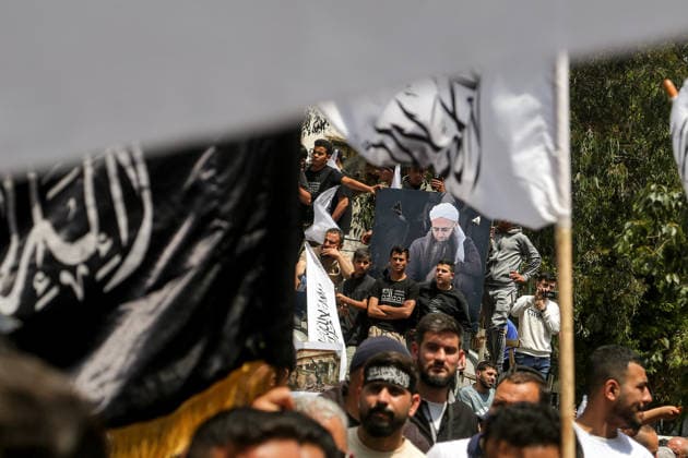 May 22, 2026, Beirut, Beirut, Lebanon: Supporters of imprisoned Islamic prisoners and Salafist cleric Ahamd al-Assir gather around his poster during a protest demanding the release and al-Assir in a proposed General Amnesty Law. The law was stalled after supporters and families of Islamists have taken the streets to demand releases and sentence reductions, a key point of contention is whether the pardon will cover al-Assir, who was sentenced to death by a military court for 2013 and 2014 clashes with the Lebanese Armed Forces. Beirut Lebanon  - ZUMAn313 20260522_zip_n313_005 Copyright: xMarwanxNaamanix