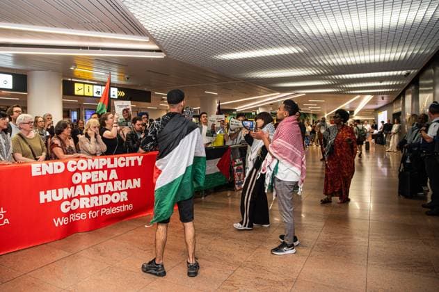 Pro-Palestinian activists pictured before Belgian activists who were part of the Gaza Flotilla arrive at Brussels Airport, in Zaventem, Friday 22 May 2026.  EMILExWINDAL 174748926