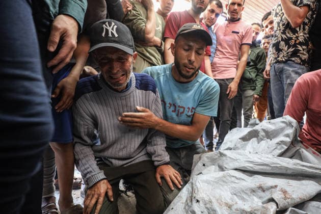 Two Palestinians were killed in Israeli attacks in Gaza GAZA CITY, GAZA, PALESTINE - MAY 22: Relatives of the 27-year-old Palestinian Loay Basal mourn as his body is brought to Al-Shifa Hospital following an Israeli military attack on the eastern part of Gaza City, despite the ongoing ceasefire, on May 22, 2026 in Gaza City, Gaza, Palestine. Two Palestinians were reported killed and several others injured as a result of continued Israeli strikes across the Gaza Strip. Khames Alrefi Anadolu Gaza City Gaza. Editorial use only. Please get in touch for any other usage.  Copyright: x2026xAnadoluxKhamesxAlrefix