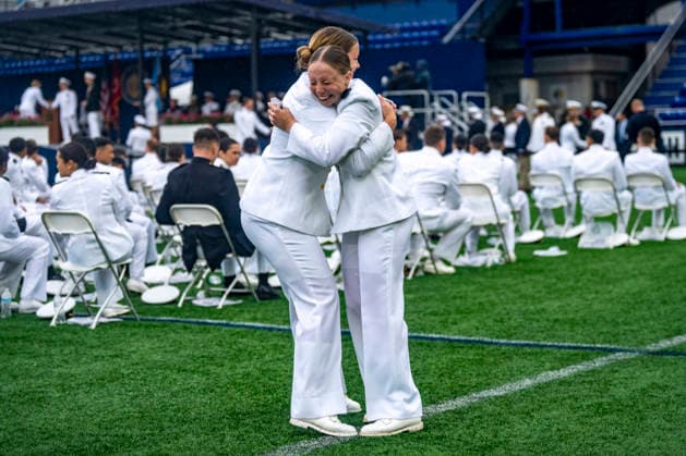 Midshipmen celebrate after receiving their diplomas during the U.S. Naval Academy Graduation and Commissioning Ceremony at the U.S. Naval Academy in Annapolis, Maryland on Friday, May 22, 2026. The Naval Academy has a total of 1059 graduates.  ANN20260522338 BONNIExCASH