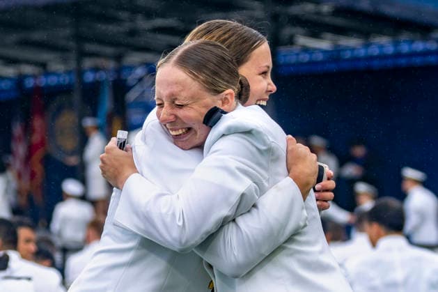 Midshipmen celebrate after receiving their diplomas during the U.S. Naval Academy Graduation and Commissioning Ceremony at the U.S. Naval Academy in Annapolis, Maryland on Friday, May 22, 2026. The Naval Academy has a total of 1059 graduates.  ANN20260522339 BONNIExCASH