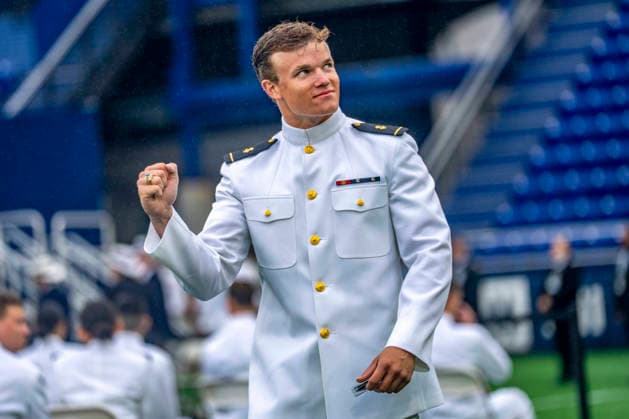 Midshipmen celebrate after receiving their diplomas during the U.S. Naval Academy Graduation and Commissioning Ceremony at the U.S. Naval Academy in Annapolis, Maryland on Friday, May 22, 2026. The Naval Academy has a total of 1059 graduates.  ANN20260522340 BONNIExCASH