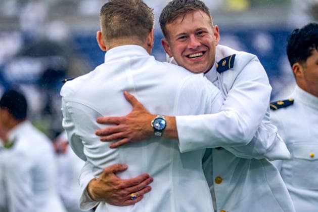 Midshipmen celebrate after receiving their diplomas during the U.S. Naval Academy Graduation and Commissioning Ceremony at the U.S. Naval Academy in Annapolis, Maryland on Friday, May 22, 2026. The Naval Academy has a total of 1059 graduates.  ANN20260522337 BONNIExCASH