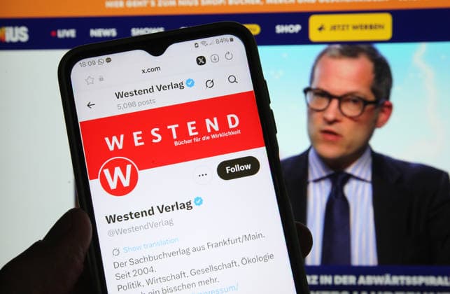 The X account of Westend Verlag was accessed on a smartphone Behind it, the online medium Nius was opened on a laptop In an open letter, 32 authors have announced their withdrawal from Westend Verlag They accuse the publishing house of bei