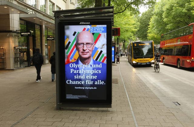 The city of Hamburg advertises on a JCDecaux billboard in Mönckebergstraße with the portrait of Mayor Peter Tschentscher for Yes votes in the referendum on May 31, in which the citys bid to host the Olympic Games and Paralympics will be put to the vote Old Town Hamburg