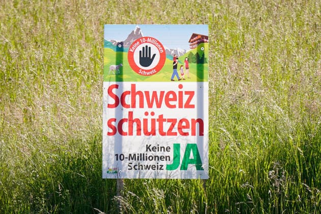 Switzerland, Europe Political poster of the Swiss Peoples Party SVP against population growth and immigration with the slogan Protect Switzerland No 10 million Switzerland YES Political campaign, referendum, Swiss p Copyright: xJOERANxSTEINSIEKx