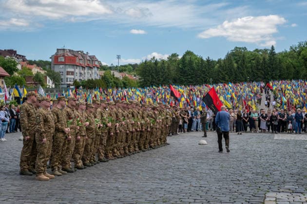 Commemoration procession held on Heroes Day in Lviv, Ukraine LVIV, UKRAINE, MAY 23: Military and civilians take part in a ceremony to honor the memory of fallen servicemen at the honorary burial grounds at the Lychakiv Cemetery during the Day of Heroes of Ukraine in Lviv, Ukraine, May 23, 2026. Also on this day, military personnel, police, members of youth organizations and civilians marched through the city in a solemn procession dedicated to all participants of the ATO JFO, war veterans and participants who died or are fighting for the freedom of Ukraine. Olena Znak Anadolu Lviv Ukraine. Editorial use only. Please get in touch for any other usage. Copyright: x2026xAnadoluxOlenaxZnakx