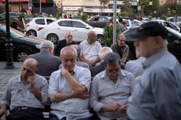 Daily Life In Iran Amid Threat About New Possible War Elderly Iranian men sit together on a sidewalk in a business district in downtown Tehran, Iran, on May 22, 2026. U.S. President Donald Trump threatens Iran with the possibility of a new conflict, with reports indicating he is considering military action if no agreement is reached with Iranian officials. Tehran Tehran Iran  Copyright: xMortezaxNikoubazlx originalFilename: nikoubazl-dailylif260522_npmou