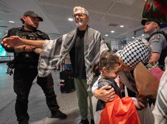 May 23, 2026, Montreal, Pq, CANADA: Ehab Lotayef, left, and Safa Chebbi, right, are greeted as they arrive back at Montreal s Trudeau International Airport on Saturday, May 23, 2026. Chebbi and Lotayef were two of the 12 Canadians who were on board a flotilla trying to reach Gaza and spent four days in Israeli captivity. Montreal CANADA - ZUMAc35_ 20260523_zaf_c35_153 Copyright: xPeterxMccabex