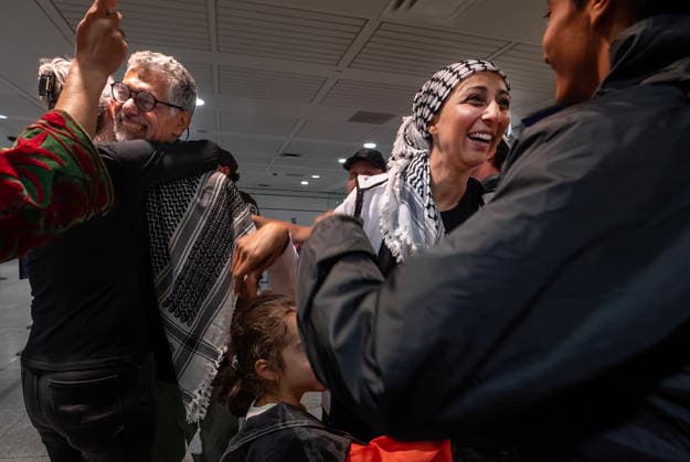 May 23, 2026, Montreal, Pq, CANADA: Ehab Lotayef, left, and Safa Chebbi, right, are greeted as they arrive back at Montreal s Trudeau International Airport on Saturday, May 23, 2026. Chebbi and Lotayef were two of the 12 Canadians who were on board a flotilla trying to reach Gaza and spent four days in Israeli captivity. Montreal CANADA - ZUMAc35_ 20260523_zaf_c35_154 Copyright: xPeterxMccabex