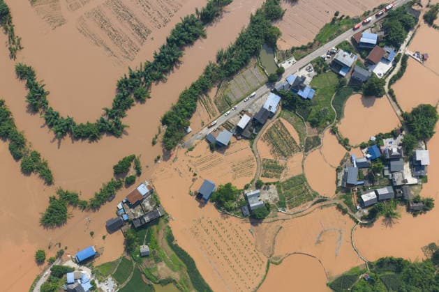 CHONGQING, CHINA - MAY 24: Aerial view of flooded Anxi Village after extreme rainfalls trigger flash floods and geological disasters on May 24, 2026 in Yongchuan District, Chongqing City, China. Devastating rainstorms struck parts of Southwest China s Chongqing over the weekend, resulting in multiple casualties and missing people in the municipality s Yongchuan and Beibei districts. Rescue efforts are ongoing. As of 2:30 pm on May 24, local authorities reported three deaths and 17 people missing in Yongchuan, with another two people missing in Beibei.  Copyright: xChinaxNewsxServicex 111643846468