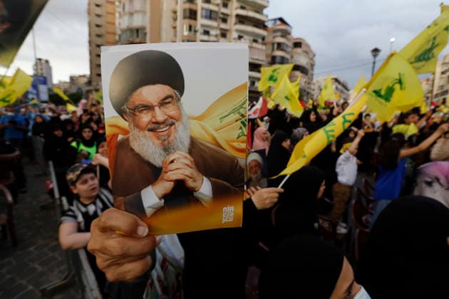May 25, 2026, Beirut, Beirut, lebanon: Supporters of Hezbollah gather during a mass rally marking the 26th anniversary of LebanonÃ¢â‚¬â ¢s Liberation and Resistance Day in the southern suburbs of Beirut, Lebanon, amid ongoing cross-border tensions and continued Israeli strikes on parts of the country. Beirut lebanon  - ZUMAb339 20260525_znp_b339_006 Copyright: xAbdulxKaderxAlxBayx