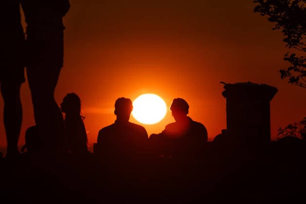 Warm May weather in the Taunus People watching the sunset from the Großer Feldberg in the Taunus , Schmitten Hessen Germany