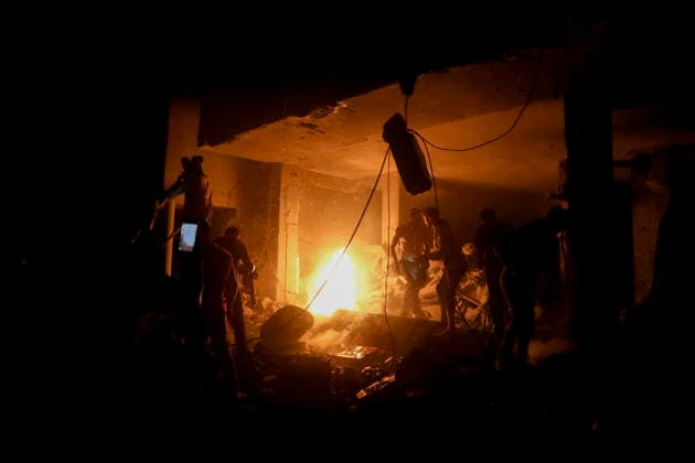 Nuseirat Homes Destroyed Airstrike May 25 Palestinian residents gather to extinguish a fire in a building following an Israeli airstrike in Nuseirat in the central Gaza Strip on May 25, 2026. It was reported that five houses were destroyed and dozens more damaged in the strikes. Nuseirat Gaza Strip Palestinian Territories Copyright: xAhmedxYounisx