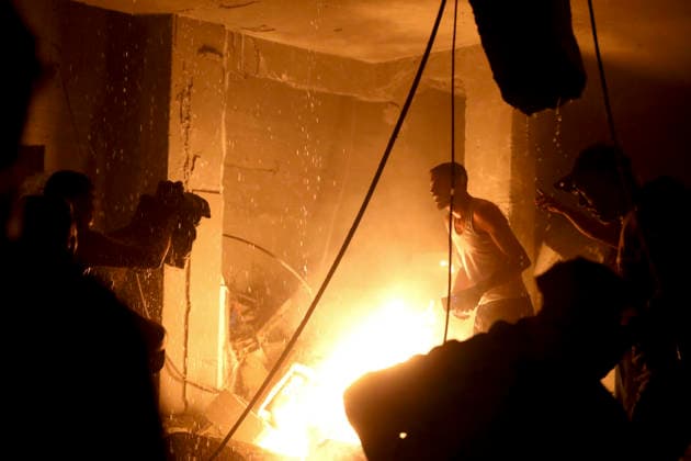 Nuseirat Homes Destroyed Airstrike May 25 Palestinian residents gather to extinguish a fire in a building following an Israeli airstrike in Nuseirat in the central Gaza Strip on May 25, 2026. It was reported that five houses were destroyed and dozens more damaged in the strikes. Nuseirat Gaza Strip Palestinian Territories Copyright: xAhmedxYounisx