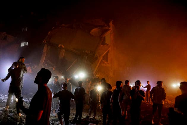Nuseirat Homes Destroyed Airstrike May 25 Palestinian residents gather as fire billows from a damaged building following an Israeli airstrike in Nuseirat in the central Gaza Strip on May 25, 2026. It was reported that five houses were destroyed and dozens more damaged in the strikes. Nuseirat Gaza Strip Palestinian Territories Copyright: xAhmedxYounisx
