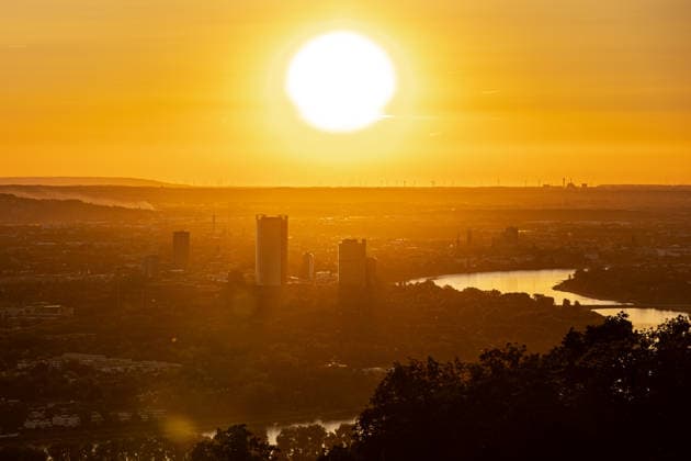 Sunset over Bonn Sunset over Bonn, taken from the Petersberg above Königswinter Due to Sahara dust, the low sun appears particularly intense in the haze, the Rhine, the Post Tower, the Lange Eugen and Cologne and numerous wind turbines can be seen on the horizon Bonn Germany Copyright: xMarcxJohnx
