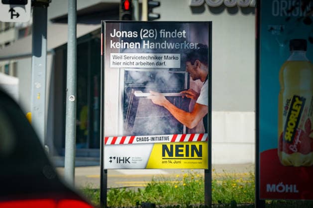 Voting poster of the IHK St Gallen Appenzell against the so-called Chaos Initiative in public spaces in St Gallen The campaign focuses on the shortage of skilled workers, the labor market and immigration and promotes a No to the bill in the referendum on 14 June Visible are political outdoor advertising and socio-political debates in the canton of St Gallen Copyright: xJOERANxSTEINSIEKx