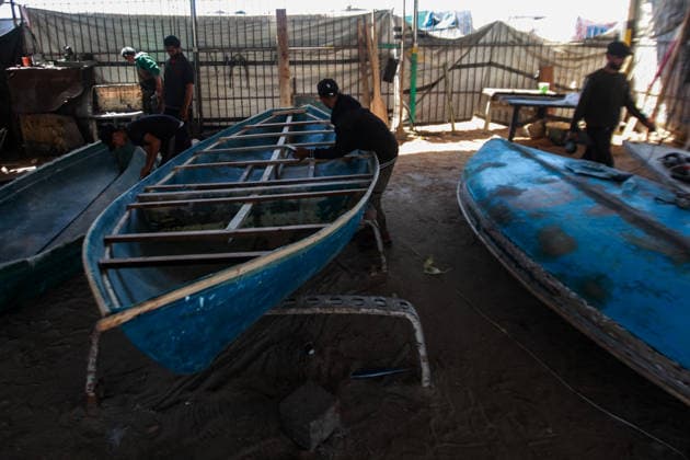 June 3, 2026, Gaza City, Gaza Strip, Palestinian Territory: June 3, 2026, Gaza, Palestine:.Palestinian fishermen repair and rebuild boats damaged during the war at Gaza s harbor, using limited tools and materials to restore their vessels. The fishing sector, a key source of income for many families, continues to face significant challenges as workers strive to return boats to the sea and revive their livelihoods amid ongoing hardship. Credit: Gaza City Palestinian Territory  - ZUMAz119 20260603_zip_z119_005 Copyright: xHashemxZimmox