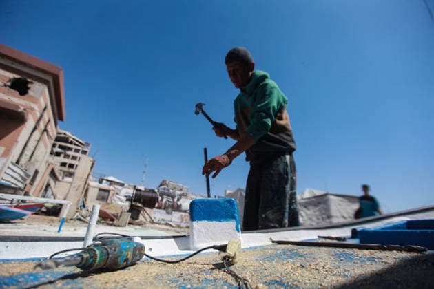 June 3, 2026, Gaza City, Gaza Strip, Palestinian Territory: June 3, 2026, Gaza, Palestine:.Palestinian fishermen repair and rebuild boats damaged during the war at Gaza s harbor, using limited tools and materials to restore their vessels. The fishing sector, a key source of income for many families, continues to face significant challenges as workers strive to return boats to the sea and revive their livelihoods amid ongoing hardship. Credit: Gaza City Palestinian Territory  - ZUMAz119 20260603_zip_z119_006 Copyright: xHashemxZimmox