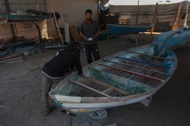 June 3, 2026, Gaza City, Gaza Strip, Palestinian Territory: June 3, 2026, Gaza, Palestine:.Palestinian fishermen repair and rebuild boats damaged during the war at Gaza s harbor, using limited tools and materials to restore their vessels. The fishing sector, a key source of income for many families, continues to face significant challenges as workers strive to return boats to the sea and revive their livelihoods amid ongoing hardship. Credit: Gaza City Palestinian Territory  - ZUMAz119 20260603_zip_z119_002 Copyright: xHashemxZimmox