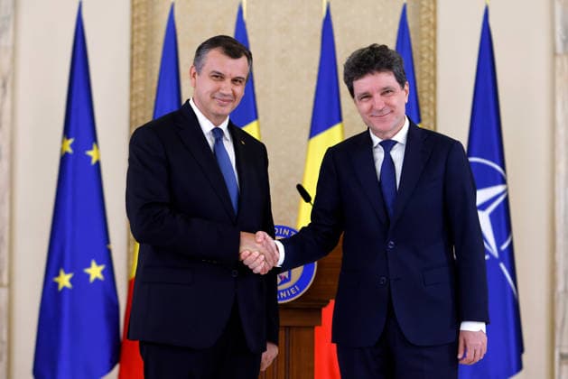 (260604) -- BUCHAREST, June 4, 2026 -- Romania s prime minister-designate Eugen Tomac (L) shakes hands with Romanian President Nicusor Dan at Cotroceni palace in Bucharest, Romania, on June 4, 2026. Romanian President Nicusor Dan on Thursday nominated his adviser Eugen Tomac as prime minister-designate. (Photo by Xinhua) ROMANIA-BUCHAREST-PM-DESIGNATE CristianxCristel 