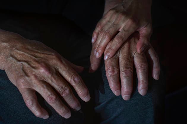 Doctor holding hand offering comfort and healthcare support indoors model released, Symbolfoto, AZF01284