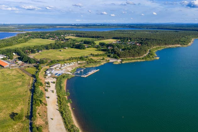Lusatian Lake District Partwitzer See DEU Germany Saxony Partwitz, 03 06 2026, Partwitzer See with beach and location Partwitz in the Lusatian Lake District, The Lusatian Lake District is to be officially opened at the end of June 2026 as a coherent and navigable chain of lakes Aerial view with a drone AF_Lausitzer_Seenland_58835