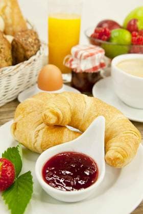 French breakfast with croissant,juice and jam on a wooden table Copyright: xjuniartx Panthermedia68878764.jpg