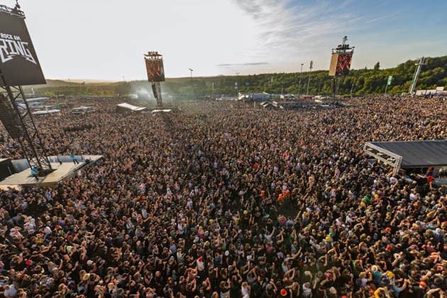 Rock am Ring 2026 Full infield 07 06 26 Tens of thousands of visitors stand in front of the Utopia Stage in the densely packed infield at Rock am Ring 2026 at the Nürburgring in Nürburg in the late afternoon The Utopia Stage, which is located in the paddock, is the largest of the three festival stages th Copyright: xMarcxJohnx