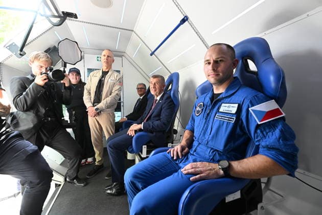 American astronaut Andrew Feustel, standing middle, and Prime Minister Andrej Babis (ANO), 2nd from right, and Czech Army pilot and reserve astronaut Ales Svoboda (right) sitting in the SpaceBuzz mobile rocket, which offers visitors a virtual journey into space and a view of Earth through the eyes of astronauts, within an an event for the Czech Journey to Space project, featuring an educational program and a virtual space mission, at Prague Exhibition Grounds, Prague Czech Republic, on June 8, 2026. (CTKxPhoto KaterinaxSulova) CTKPhotoP2026060805580  CTKPhotoP2026060805580
