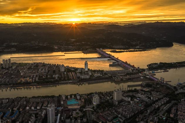(260608) -- YICHANG, June 8, 2026 -- An aerial drone photo taken on June 8, 2026 shows the upgrading site of navigation facilities at Gezhouba in Yichang, central China s Hubei Province. China on Monday began construction of a mega waterway project, including what is expected to become the world s largest inland ship lock, in response to the rising shipping demand along the Yangtze, the world s third-longest river. The 77.2-billion-yuan (about 11.3 billion U.S. dollars) project will add a five-tier, dual-track ship lock north of the existing lock at the Three Gorges Dam, the world s largest water conservancy project, and upgrade navigation facilities at a smaller downstream dam. The new ship lock and its approach channels, which toge